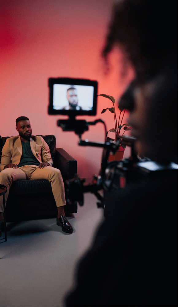 One person behind a camera on set